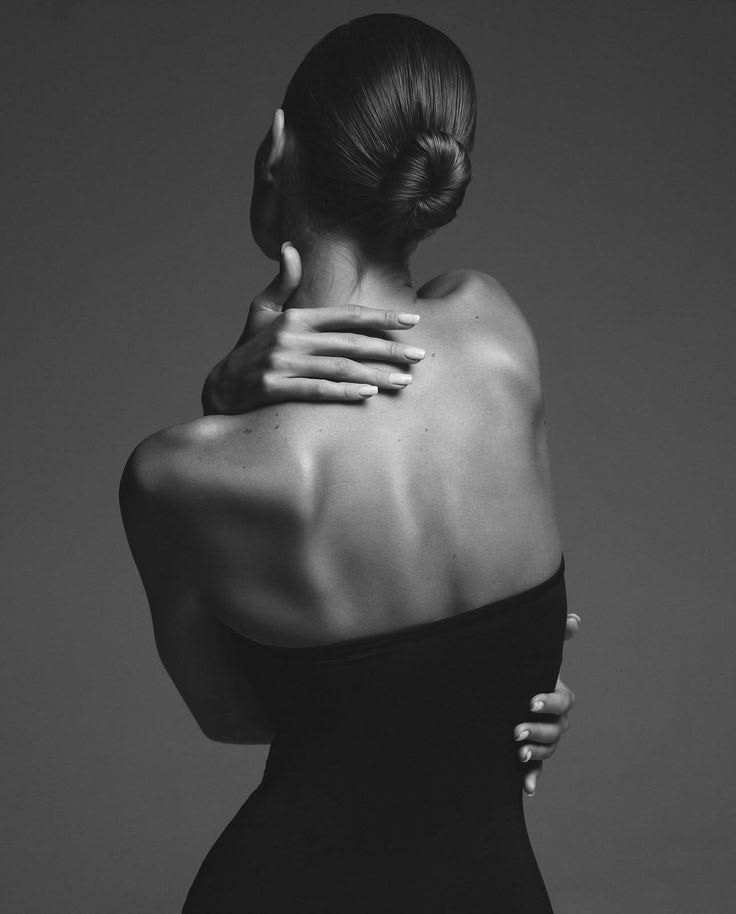 Bare back and shoulders in soft low light