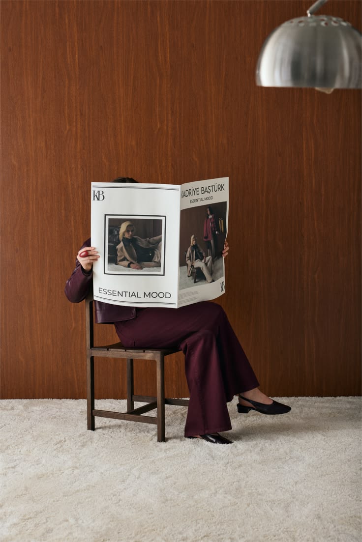 A woman reading by a bright window